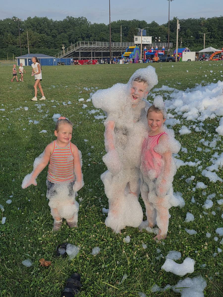 Kids covered in foam at a WWJK foam party